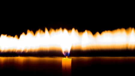 burning memorial candles on dark background .の写真素材