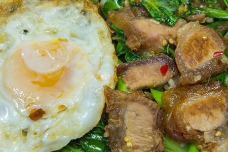 Thai menu - Crispy pork belly stir-fried with Kale, Garlic and Chili, normally eat with steamed rice and on top with fried egg.の写真素材