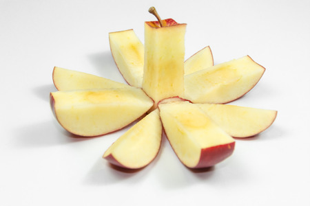 Cutting style of red apple into flower bloom.の写真素材