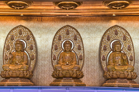 Khlong Sam Wa, Bangkok, Thailand - October 27, 2019 : Fo Guang Shan Thaihua Temple - 3 Buddha statues inside the temple.のeditorial素材