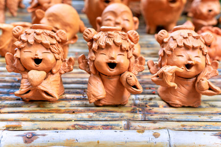 Lopburi, Thailand - November 2, 2019: Community Ban Din Mot Daeng Market. Clay dolls, Little angels.のeditorial素材