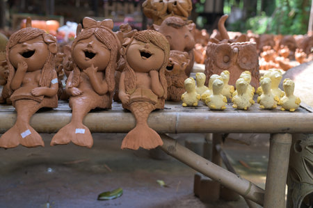 Lopburi, Thailand - November 2, 2019: Community Ban Din Mot Daeng Market.Mermaid and little duck made by clay.のeditorial素材