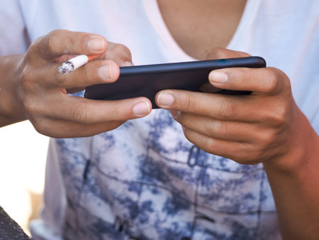 Closeup Of Lonely . Hands Is Holding Cellphone