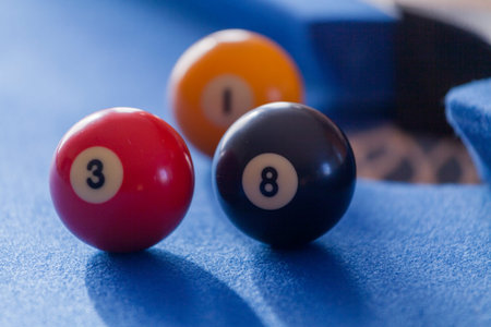 Focus on red and black billiard balls