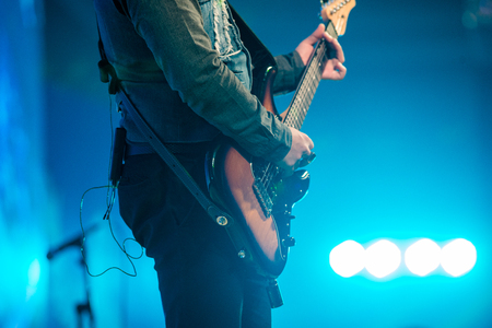 Rock band performs live in concert. guitar. Close-upの写真素材