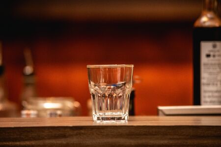 Empty glass on the brown table at  restaurant.の写真素材