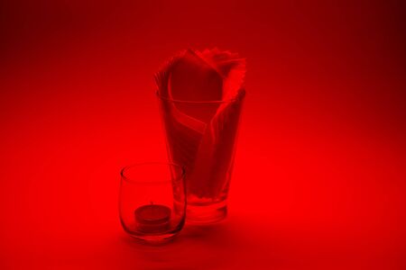 Decorate on white background. Tissue in a glass on an orange background.の写真素材