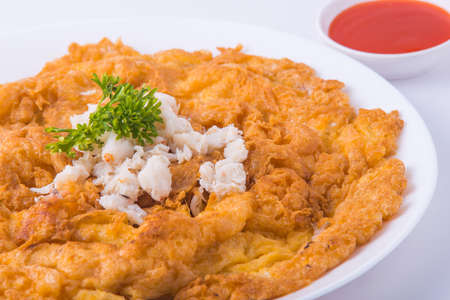 Popular Thai food. Crab omelette in the white dish.の写真素材