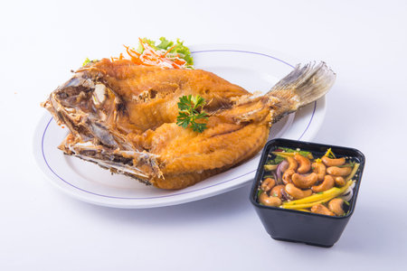 Fish fried with Sour Sauce on white plate.