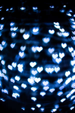 Bokeh blue heart on black background. feeling romance.の写真素材