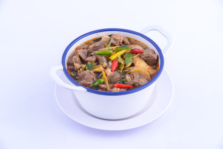 Thai favorite food. Spicy chicken soup (Tom Yum Gai Baan) in the white bowl.の写真素材