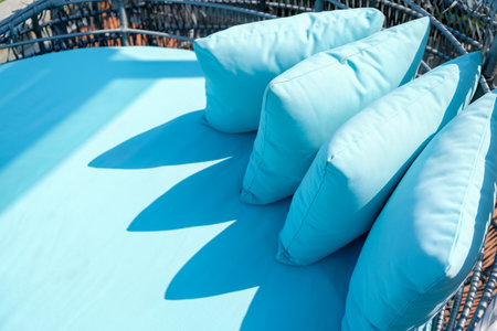 Blue pillows on the terrace of a coffee shop in summerの写真素材