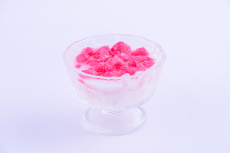 Raspberry ice cream in glass bowl on white background, stock photoの写真素材