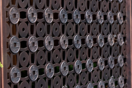 Close-up of the metal gate of the Shinto shrine.