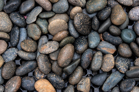 Pebble rocks background on the water.の写真素材