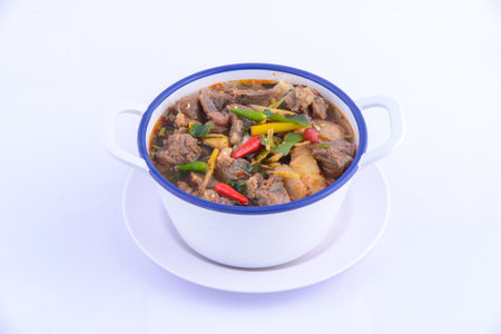 Thai favorite food. Spicy chicken soup (Tom Yum Gai Baan) in the white bowl.の写真素材