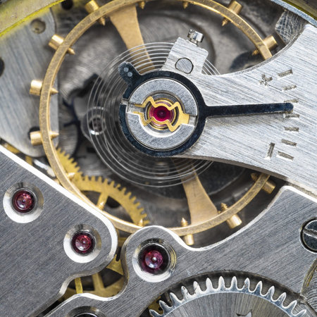 adjusting arrow in old mechanical watch close up