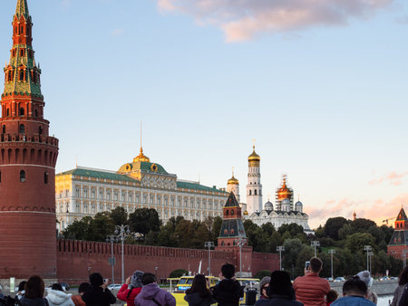 MOSCOW, RUSSIA - SEPTEMBER 27, 2018: tourists take pictures of Moscow Kremlin from boat on Moskva...