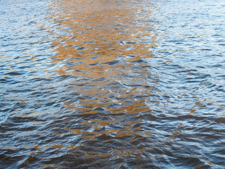 view of ripples on water surface of Moskva river in autumn evening
