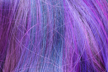 blue and purple colored hair strands close upの写真素材