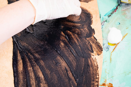 workshop of making the carved leather bag - craftsman colors the stamped leather for handbagの写真素材