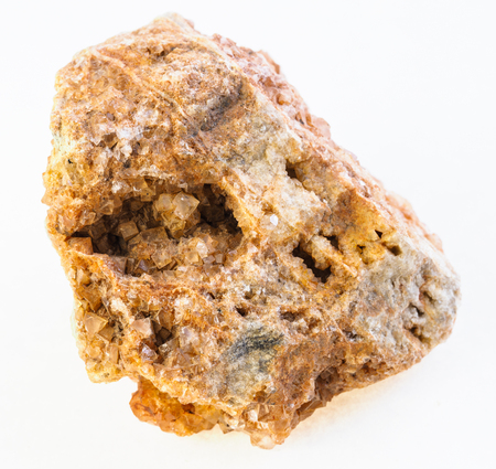 macro photography of natural mineral from geological collection - wulfenite crystals in rough stone on white backgroundの写真素材