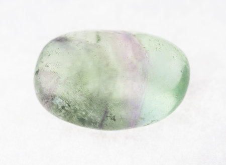 macro photography of natural mineral from geological collection - tumbled fluorite (fluorspar)...