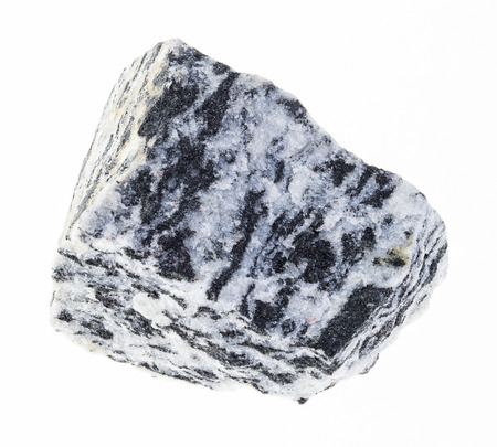macro photography of natural mineral from geological collection - rough migmatite gneiss stone on white backgroundの写真素材