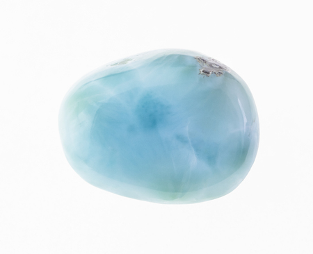 macro photography of natural mineral from geological collection - tumbled larimar (stefilia stone) gem on white backgroundの写真素材