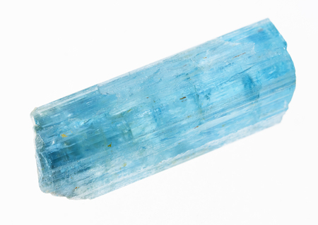 macro photography of natural mineral from geological collection - raw aquamarine (blue beryl) crystal on white backgroundの写真素材