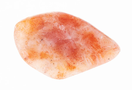 macro photography of natural mineral from geological collection - tumbled sunstone (heliolite) gem stone on white backgroundの写真素材