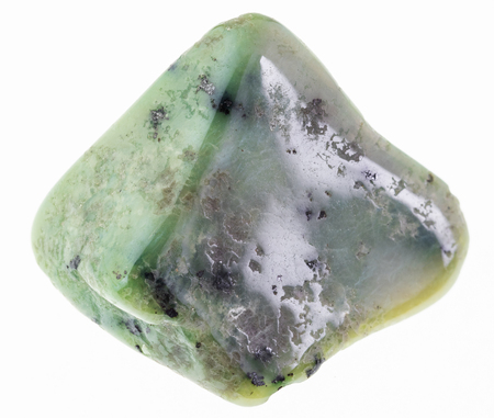 macro photography of natural mineral from geological collection - tumbled green garnet Grossular gem stone on white backgroundの写真素材