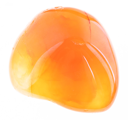 macro photography of natural mineral from geological collection - polished carnelian gem stone on white backgroundの写真素材