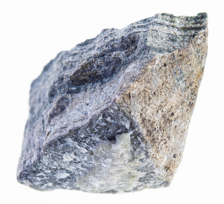 macro photography of natural mineral from geological collection - rough skarn stone on white backgroundの写真素材