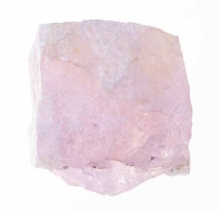 macro photography of natural mineral from geological collection - raw morganite (vorobievite, pink beryl) stone on white backgroundの写真素材