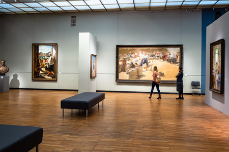 MOSCOW, RUSSIA - JANUARY 18, 2019: visitors in room in main exhibition of New Tretyakov Gallery of Modern Art on Krymsky Val in Moscow. This museum is a branch of The State Tretyakov Galleryのeditorial素材