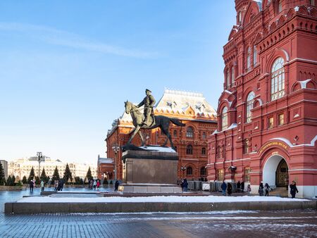 MOSCOW, RUSSIA - JANUARY 25, 2019: people near Monument of Soviet Commander Marshal Georgy Zhukov in front of State Historical Museum at Manezhnaya square in Moscow in winterのeditorial素材
