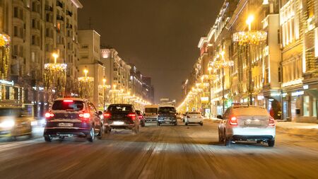 MOSCOW, RUSSIA - JANUARY 26, 2019: panoramic view of Tverskaya street with cars in Moscow city at winter night. Tverskaya Street (former Gorky Street) is the main radial street in Moscowのeditorial素材