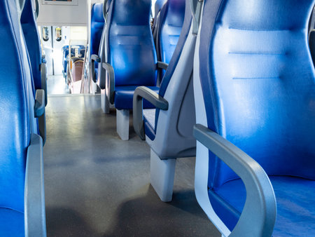 interior of railway passenger car of the second class in train in Lombardy in Italy