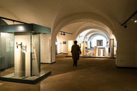 BRESCIA, ITALY - FEBRUARY 21, 2019: visitor in hall of Monastery of Santa Giulia in Brescia. Santa Giulia inscribed on the List of World Heritage of UNESCO as Longobards in Italy, Places of the powerのeditorial素材