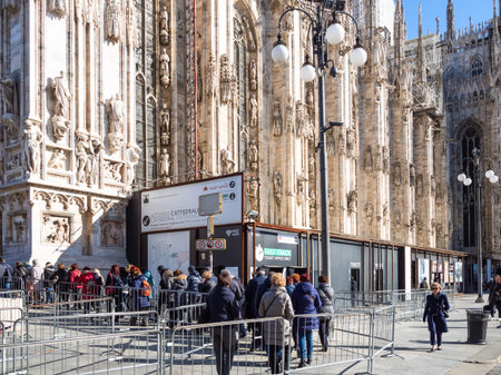 MILAN, ITALY - FEBRUARY 24, 2019: queue of tourists for entrance in Milan Cathedral (Duomo di Milano) in Milan city in winter morning. This Basilica is the largest church in Italyのeditorial素材