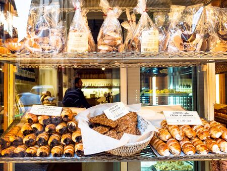 BERGAMO, ITALY - FEBRUARY 25, 2019: window of bakery with traditional local biscuits and pastries in Citta Alta (Upper Town) of Bergamo city, Lombardyのeditorial素材