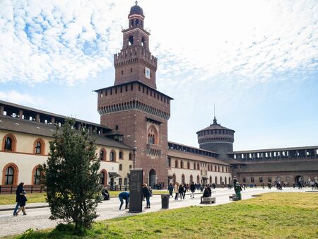 MILAN, ITALY - FEBRUARY 24, 2019: people in courtyard near Tower Torre del Filarete in Castello Sforzesco (Sforza Castle) in Milan. The Castel was built by Duke of Milan Francesco Sforza in15th centのeditorial素材