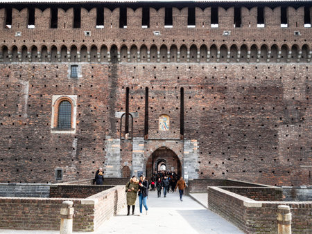 MILAN, ITALY - FEBRUARY 24, 2019: visitors in gate to fortress Castello Sforzesco (Sforza Castle) in Milan city. The Castel was built by Duke of Milan Francesco Sforza in15th centのeditorial素材
