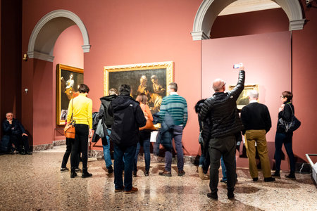 MILAN, ITALY - FEBRUARY 24, 2019: tourist photographs pictures in Pinacoteca di Brera (Brera Art...