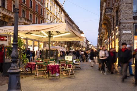 MILAN, ITALY - FEBRUARY 24, 2019: people on square Largo Cairoli and street Via Dante in Milan in evening. Milan is capital of Lombardy, the second-most populous city in Italyのeditorial素材