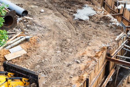 above view of construction site with trench for installation of heating pipeline and sewage