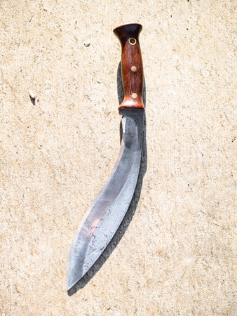 top view of Khukuri traditional Nepali knife on outdoor concrete board