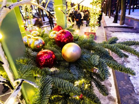MOSCOW, RUSSIA - JANUARY 2, 2020: Christmas ornaments on green tree at Tverskoy Boulevard in Moscow in evening. Tverskoy Boulevard is one of the main thoroughfares in central Moscowのeditorial素材