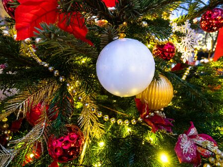MOSCOW, RUSSIA - JANUARY 2, 2020: Christmas baubles on green tree at Tverskoy Boulevard in Moscow in evening. Tverskoy Boulevard is one of the main thoroughfares in central Moscowのeditorial素材